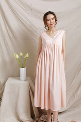 Robe mi-longue en soie avec taille empire plissée et jupe trapèze fluide