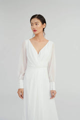Silk maxi dress with sheer long sleeves and pleated wrap front for timeless elegance