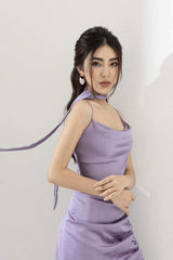 Silk midi dress with asymmetric draping, ruched side slit, and scarf neck detail