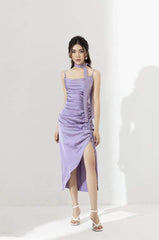 Silk midi dress with asymmetric draping, ruched side slit, and scarf neck detail