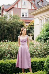 Silk midi dress with ruched bodice, wide straps, and flared skirt for elegant movement