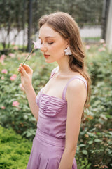 Silk midi dress with ruched bodice, wide straps, and flared skirt for elegant movement