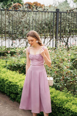 Silk midi dress with ruched bodice, wide straps, and flared skirt for elegant movement