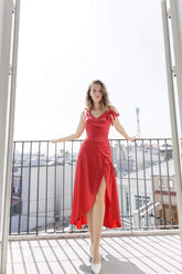 Asymmetric silk wrap dress with tie shoulder straps and high slit for modern elegance