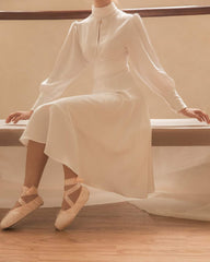 Silk midi dress with high neckline, keyhole detail, and long puff sleeves for refined elegance