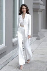 Tailored single-button silk blazer with structured shoulders and notched lapels for formal styling