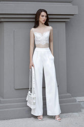 Silk lace-trimmed crop top with spaghetti straps and sculpted bodice for elegant summer styling