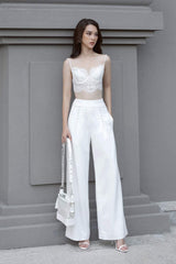 Silk lace-trimmed crop top with spaghetti straps and sculpted bodice for elegant summer styling