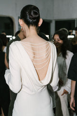 Backless Draped Evening Dress with Pearl Chain Detail and Flared Hem Silhouette