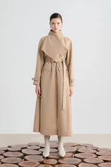Tailored wool blend trench coat with oversized lapels and structured belted waist