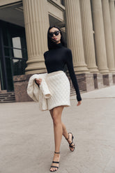 Quilted cotton blend skirt with pearl embellishments and structured high-waist design