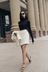 Fitted high-neck knitted wool top with long sleeves and seamless contour finish