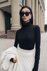 Fitted high-neck knitted wool top with long sleeves and seamless contour finish