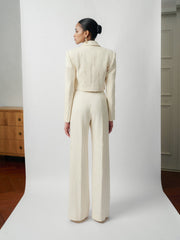 Textured wool-blend cropped jacket with peak lapels and structured shoulder tailoring