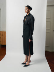 Tailored high-waisted skirt with side-wrap detail and midi silhouette