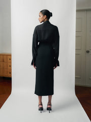 Tailored high-waisted skirt with side-wrap detail and midi silhouette