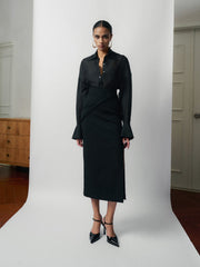 Tailored high-waisted skirt with side-wrap detail and midi silhouette