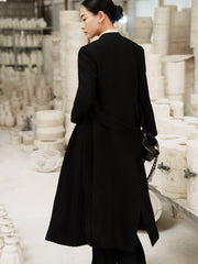 Tailored wool blend long coat with structured silhouette and minimalist open-front design