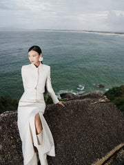 Structured bouclé midi skirt with front slit and fabric-covered buttons