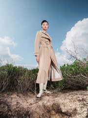 Tailored wool blend trench coat with oversized lapels and structured belted waist