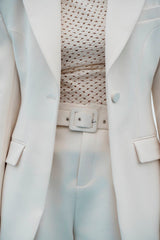 Structured longline blazer with sharp shoulders and a contoured waistline