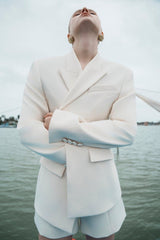 Structured longline blazer with sharp shoulders and a contoured waistline