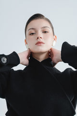 Wool wrap-style long coat with wide lapels, waist belt, and full button front closure
