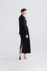 High-waisted textured skirt with back slit and sleek tailored silhouette