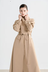 Tailored wool blend trench coat with oversized lapels and structured belted waist