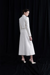 Structured bouclé midi skirt with front slit and fabric-covered buttons