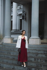 Tailored silk blazer with structured shoulders and notched lapel for refined layering