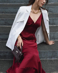 Tailored silk blazer with structured shoulders and notched lapel for refined layering