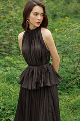 High-neck pleated silk dress with peplum waist and sleeveless halter silhouette