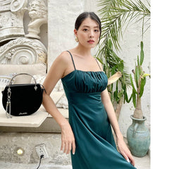 Silk midi dress with ruched bust and adjustable spaghetti straps for elegant evening wear