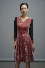 Velvet A-line dress with mesh long sleeves and V-neckline for modern evening styling