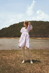 Silk mini dress with puff sleeves and ruched bodice for elegant summer and resort styling