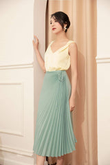 High-waisted pleated midi skirt in lightweight silk with wrap-tie detail and fluid drape