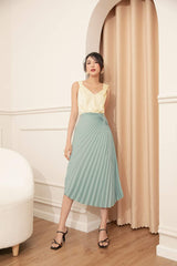 High-waisted pleated midi skirt in lightweight silk with wrap-tie detail and fluid drape