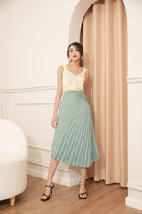 High-waisted pleated midi skirt in lightweight silk with wrap-tie detail and fluid drape