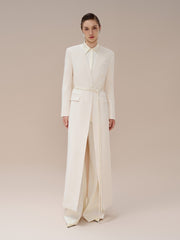 Manteau long structuré en laine mélangée avec col tailleur, ourlet fendu et poche à rabat