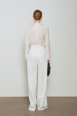 Structured blouse with gathered neckline and tailored cuffs in sheer textured fabric