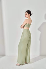 High-waisted wide-leg silk pants with tailored waistband and flowing drape