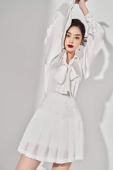 Pleated organza mini skirt with structured waistband and soft flare silhouette for women