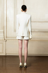 Structured longline blazer with sharp shoulders and a contoured waistline