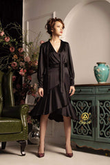 Silk wrap dress with flared hem and long sleeves in soft satin finish for elegant occasions