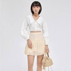 Structured pleated organza blouse with statement collar and voluminous long sleeves