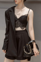Tailored longline silk blazer with structured shoulders and single-breasted button front