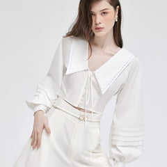 Silk blouse with oversized sailor collar and pleated lantern sleeves for feminine elegance
