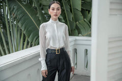 High-waisted silk pants with pleated front and tapered leg for refined tailored styling