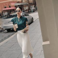 Silk top with flutter sleeves and tie-neck detail for an effortlessly elegant daytime look